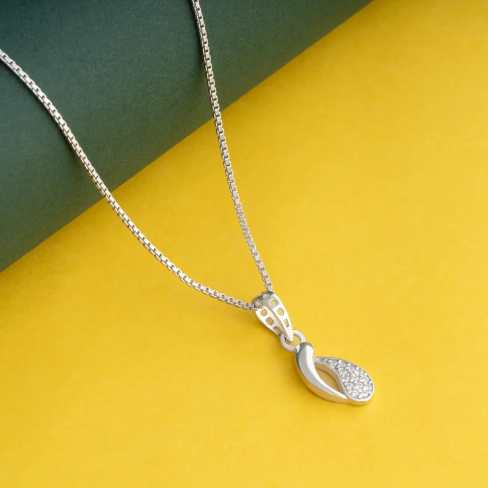 Curved Swirl Silver Pendant Necklace P4 on table