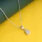 Guitar Charm Necklace P18 on table