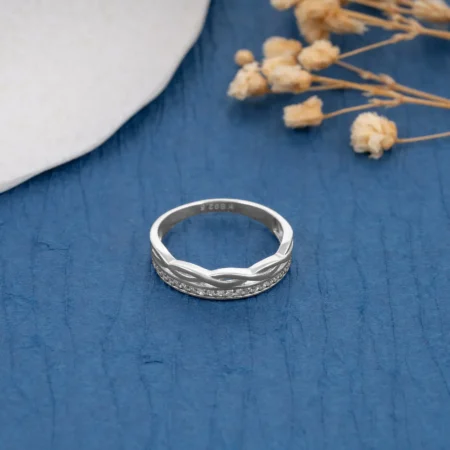 Infinity Wave Diamond Ring R 200 on table