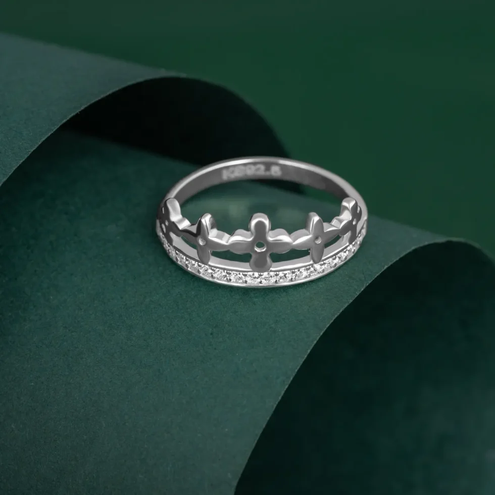 Queen’s Petal Crown Ring R 102 on table