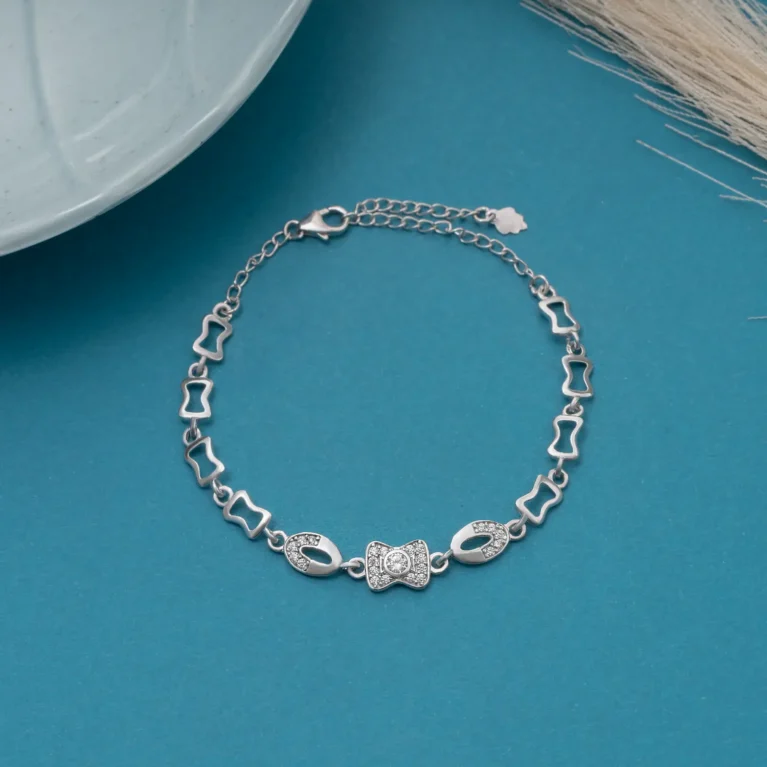 Ribbon Glow Bracelet B 112 M BKI on table