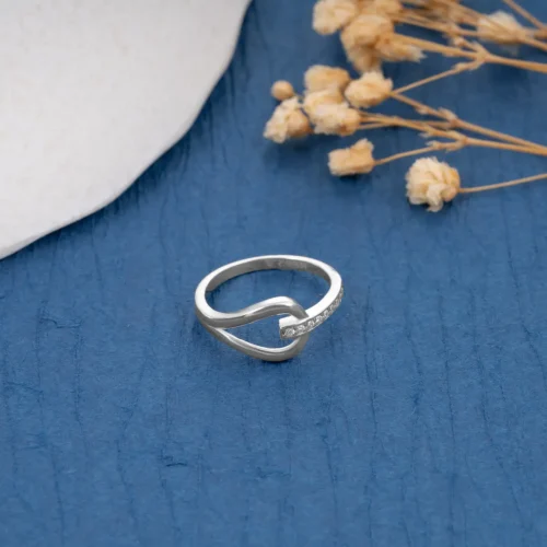 Twist Diamond Ring R 158 on table